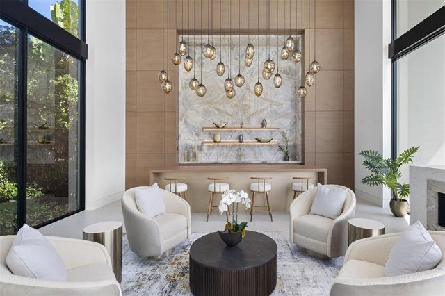a bathroom with a sink a bathtub and next to a window
