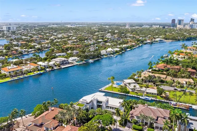 a living room with furniture and large windows
