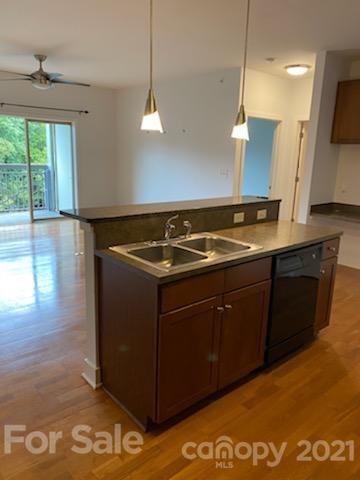 a kitchen with a sink and a stove