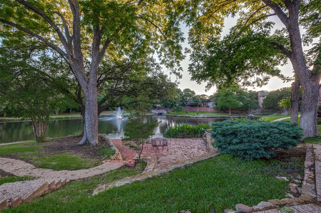 12002 Timberlake Court Dallas, TX 75230 - Photo 24 of 28 a view of a lake with a yard