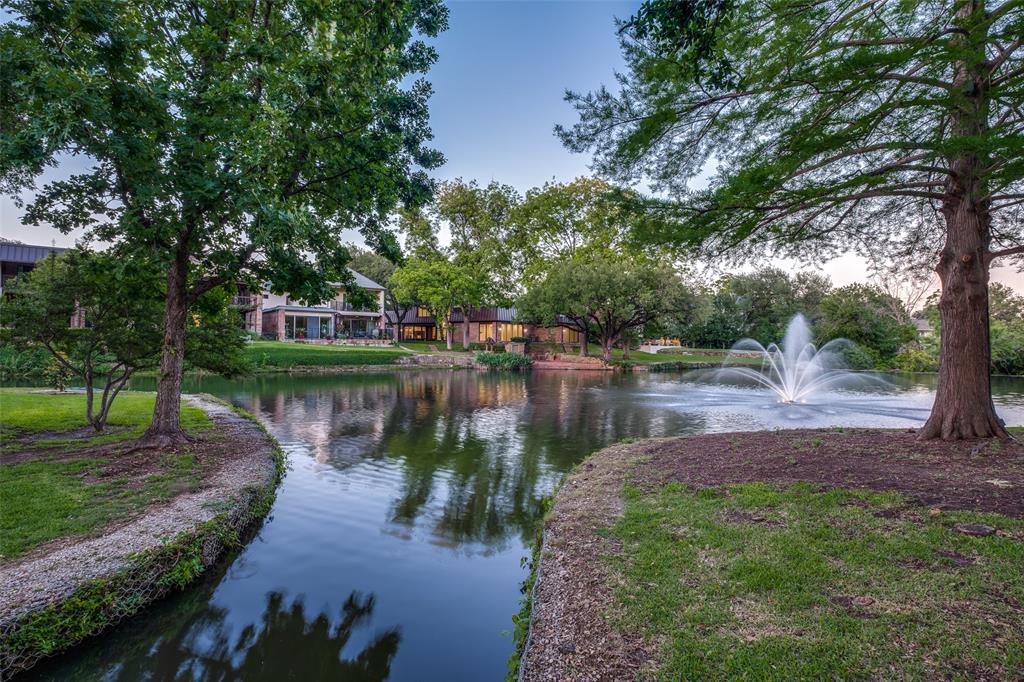 12002 Timberlake Court Dallas, TX 75230 - Photo 25 of 28 a view of a lake top with large trees
