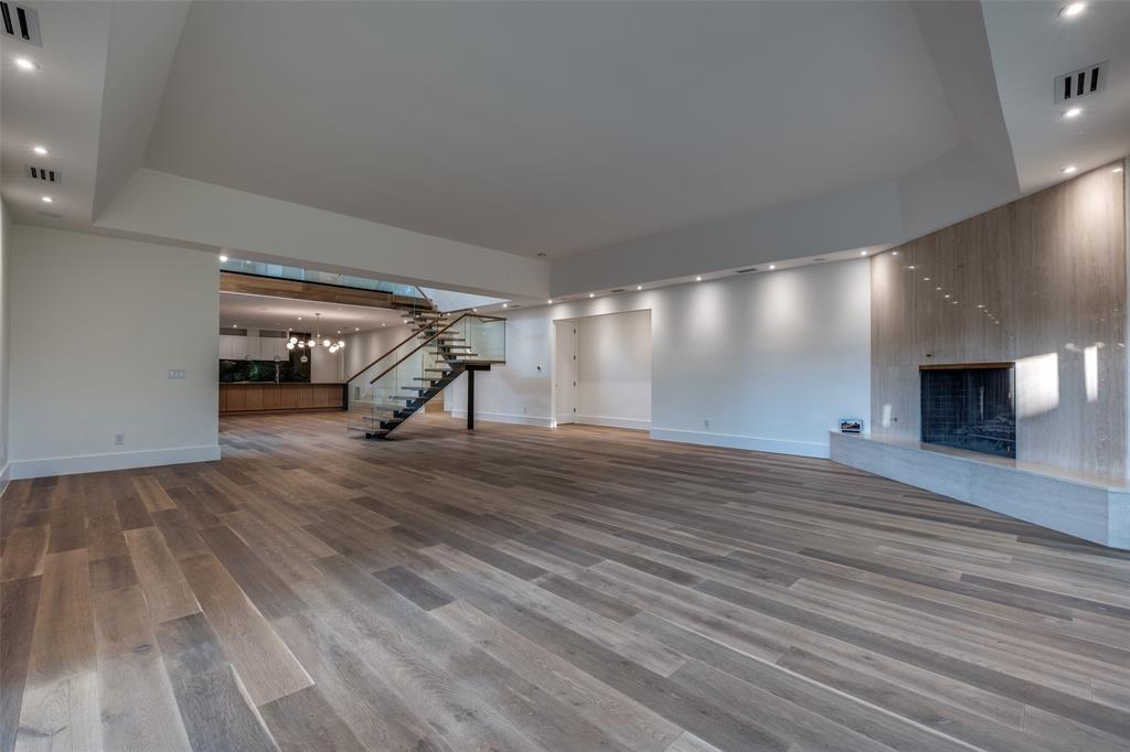 12002 Timberlake Court Dallas, TX 75230 - Photo 10 of 28 a view of empty room with wooden floor