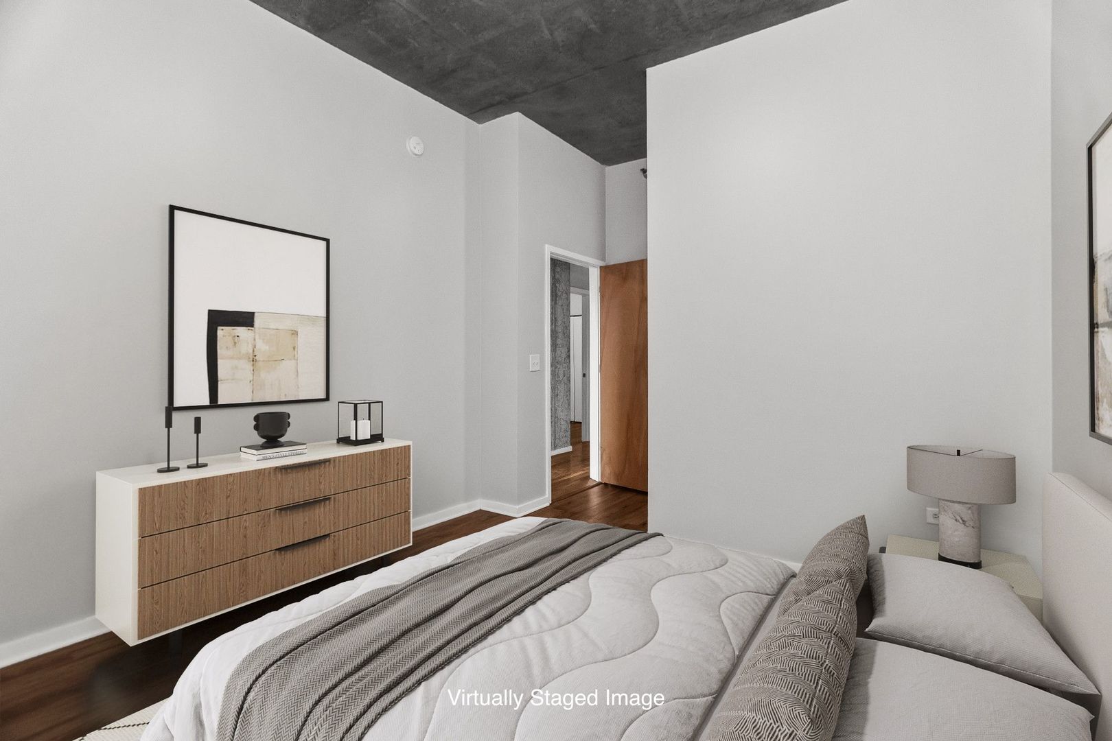 1620 South Michigan Avenue, Unit 324 Chicago, IL 60616 - Photo 14 of 23 a bedroom with a bed and a mirror