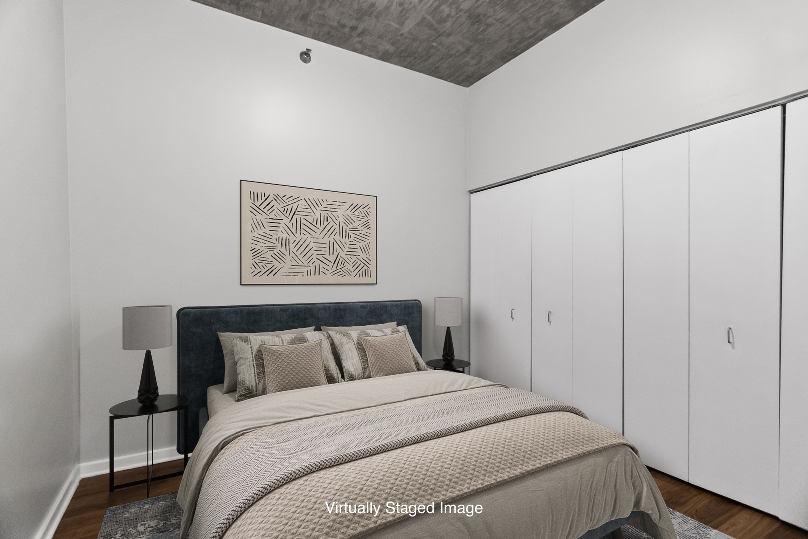 1620 South Michigan Avenue, Unit 324 Chicago, IL 60616 - Photo 16 of 23 a bedroom with a bed and a painting on the wall