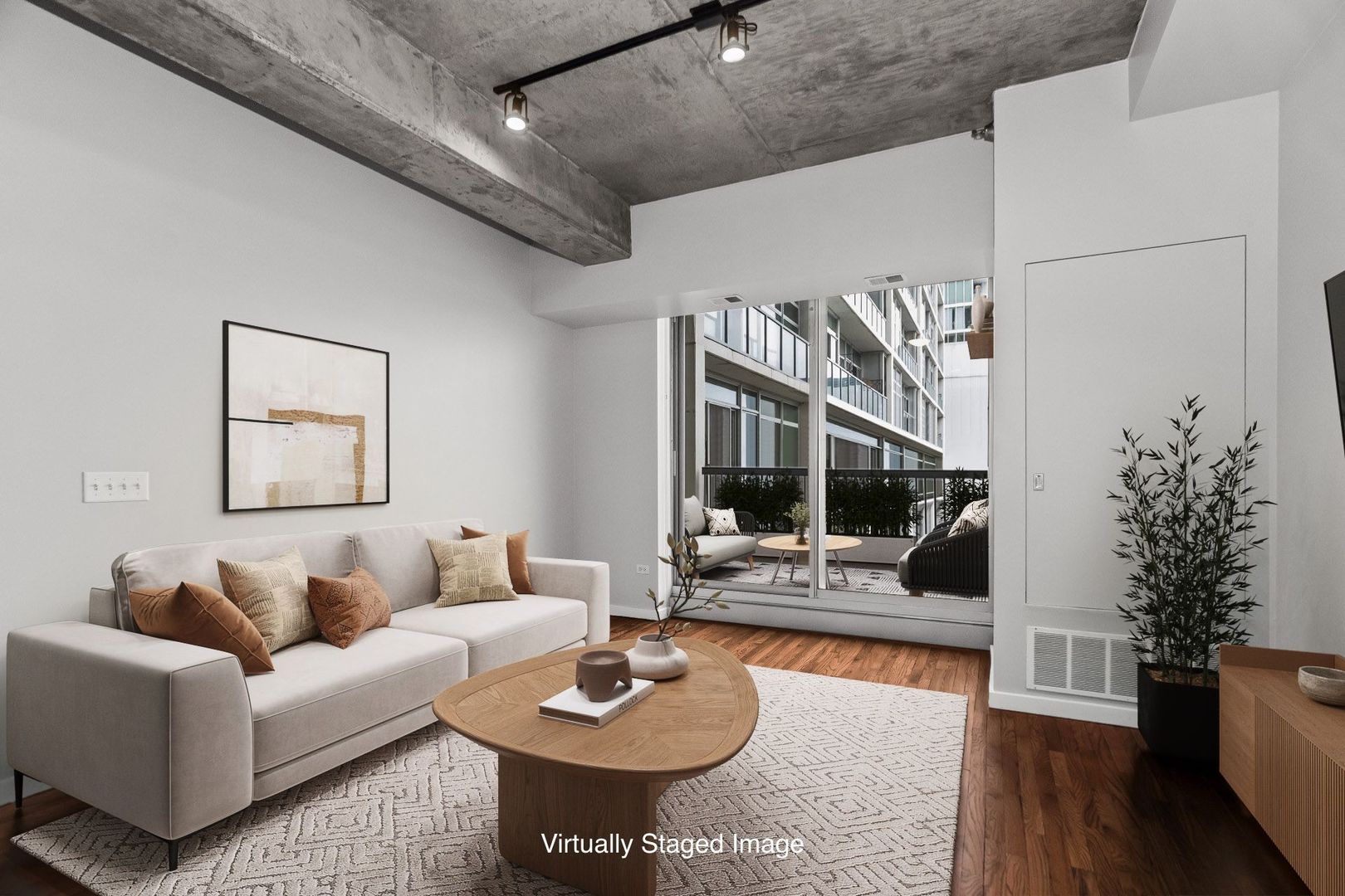1620 South Michigan Avenue, Unit 324 Chicago, IL 60616 - Photo 9 of 23 a living room with furniture and a wooden floor