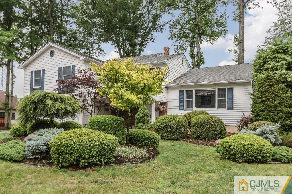 28 Fox Hill Road Edison, NJ 08820 - Photo 1 of 20 a front view of a house with a garden