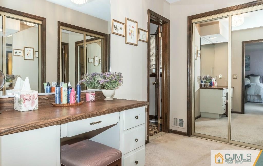 28 Fox Hill Road Edison, NJ 08820 - Photo 13 of 20 a bathroom with a granite countertop sink and a mirror