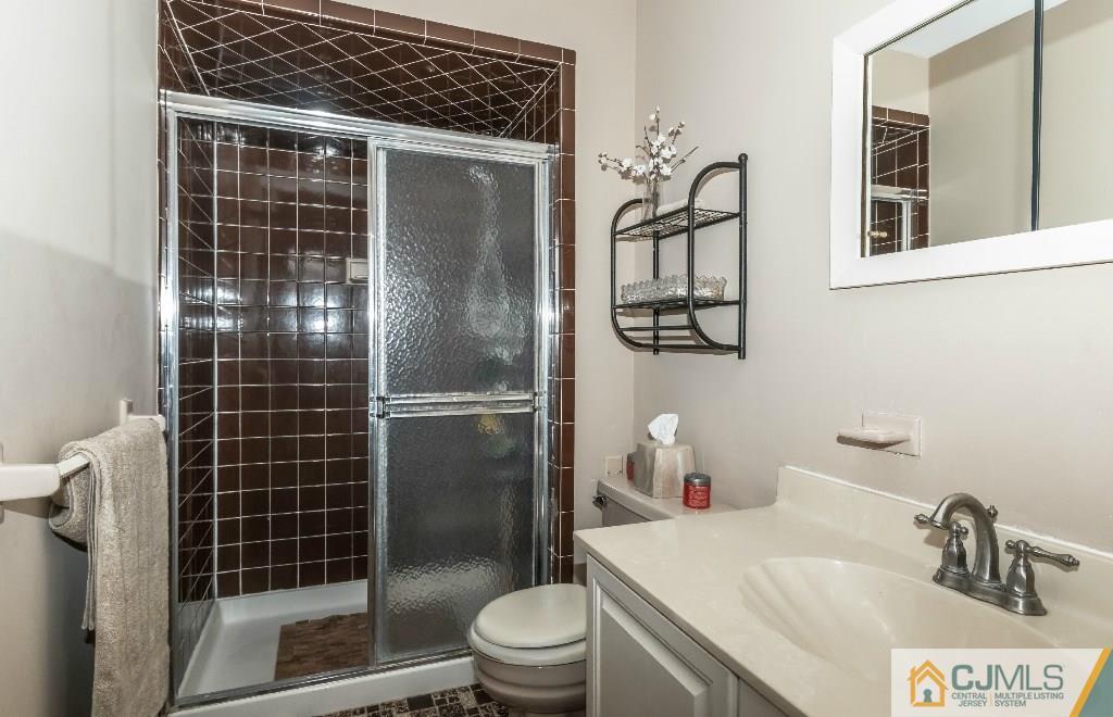 28 Fox Hill Road Edison, NJ 08820 - Photo 14 of 20 a bathroom with a shower toilet and sink