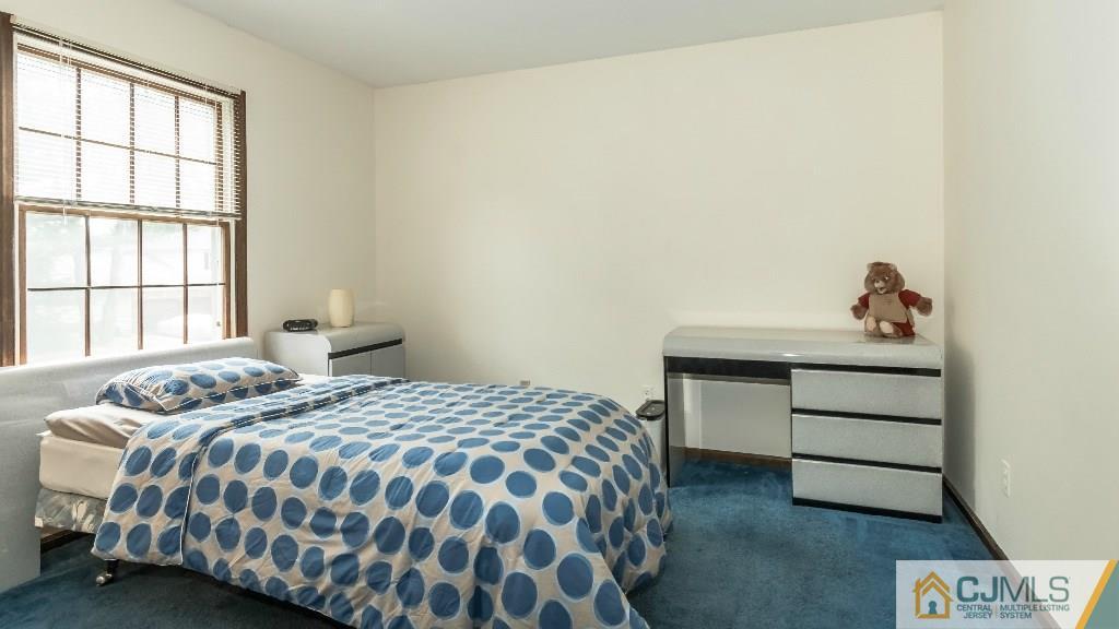 28 Fox Hill Road Edison, NJ 08820 - Photo 16 of 20 a bedroom with a bed and a window
