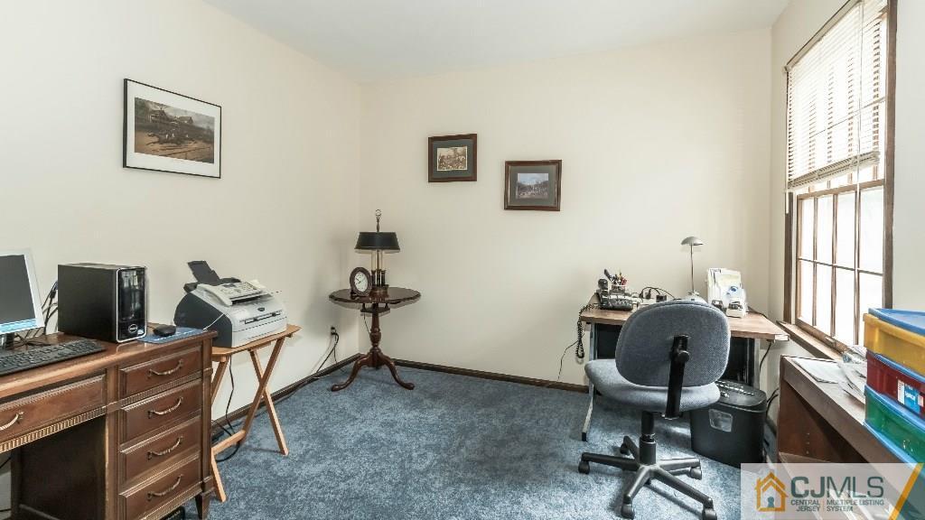 28 Fox Hill Road Edison, NJ 08820 - Photo 17 of 20 a view of a workspace with furniture and a window