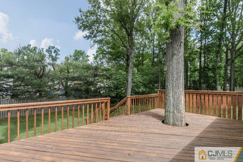 28 Fox Hill Road Edison, NJ 08820 - Photo 18 of 20 a view of a house with a wooden deck