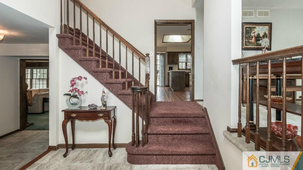 28 Fox Hill Road Edison, NJ 08820 - Photo 3 of 20 a view of entryway and hall with wooden floor