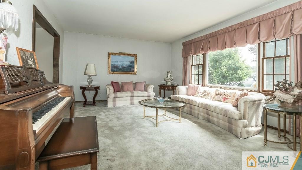 28 Fox Hill Road Edison, NJ 08820 - Photo 5 of 20 a living room with furniture and a large window