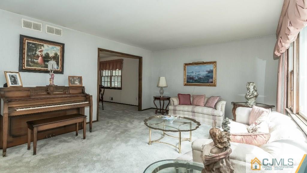 28 Fox Hill Road Edison, NJ 08820 - Photo 6 of 20 a living room with furniture piano and a window