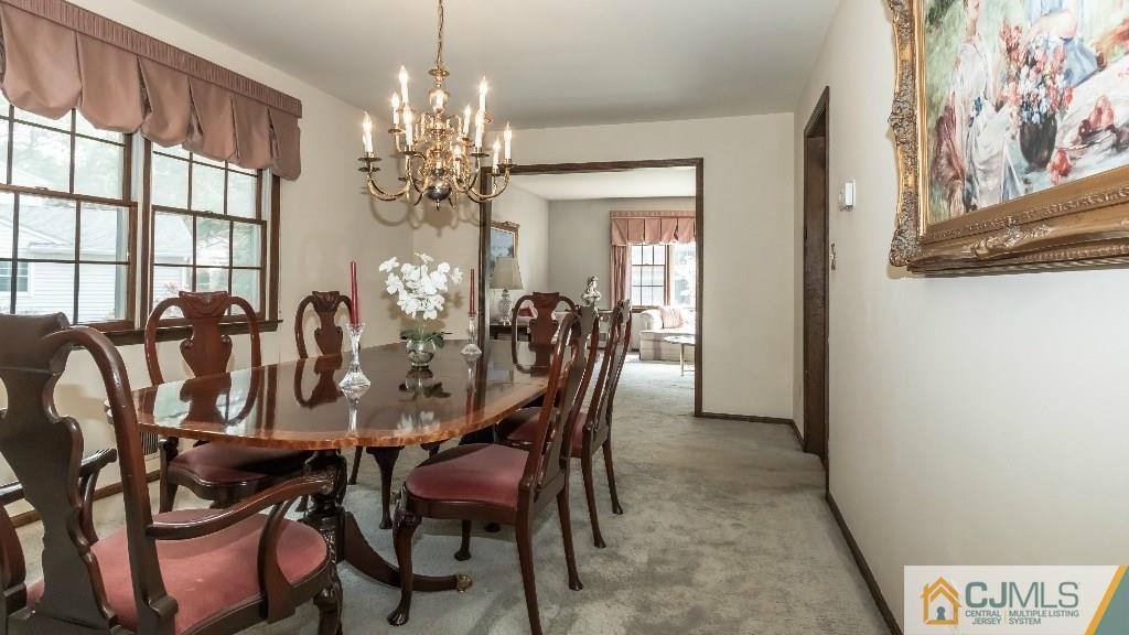 28 Fox Hill Road Edison, NJ 08820 - Photo 8 of 20 a view of a dining room with furniture and chandelier