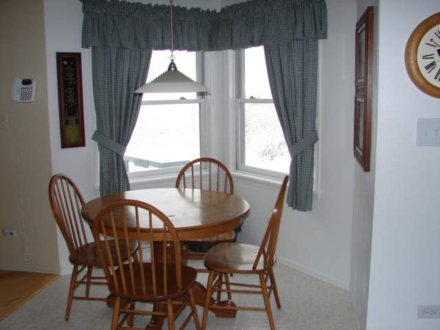 8475 West Mound Road Lena, IL 61048 - Photo 4 of 9 a view of a dining room with furniture and window