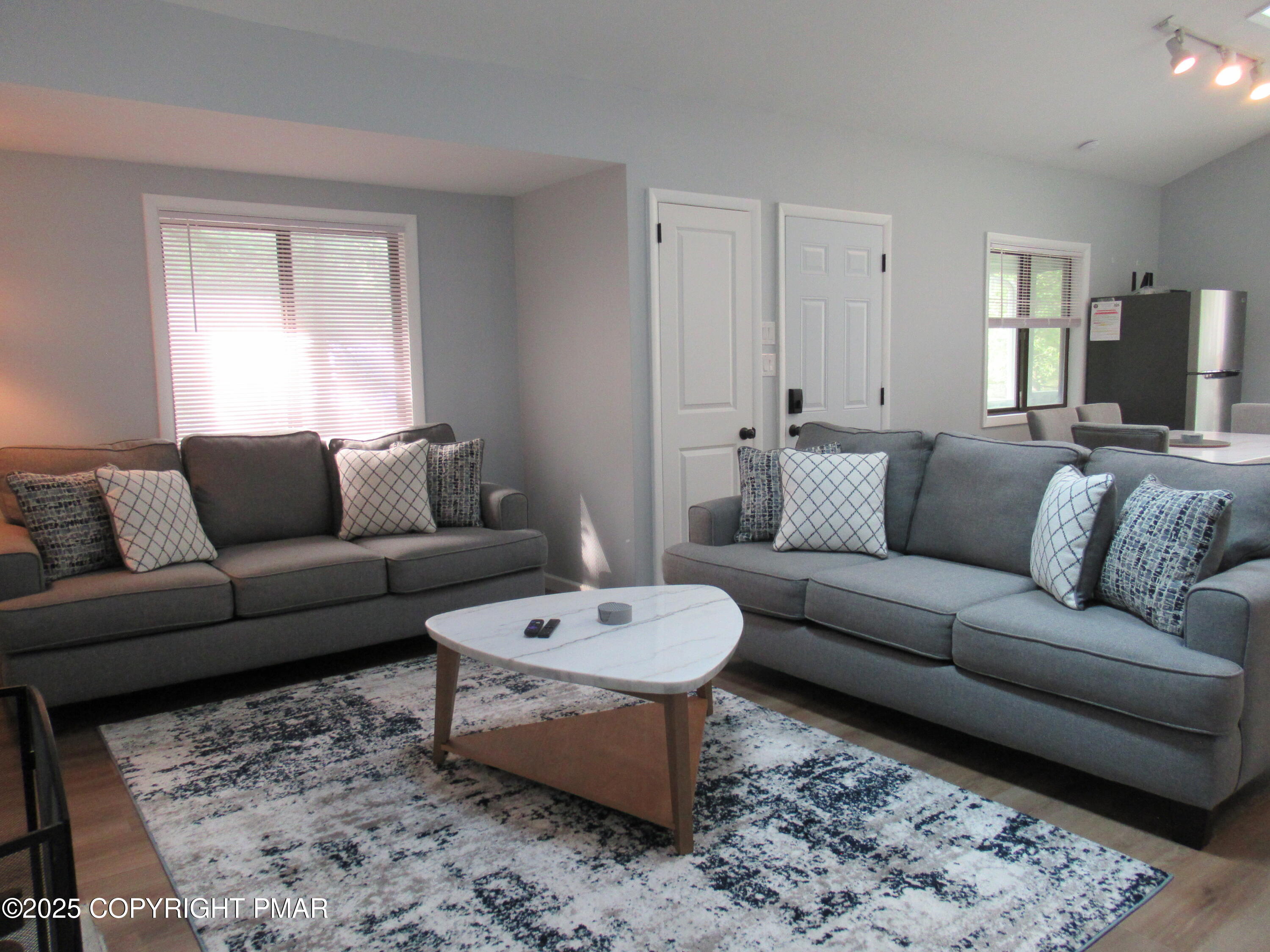 11 Maplewood Road Lake Harmony, PA 18624 - Photo 12 of 44 a living room with furniture a rug and a window