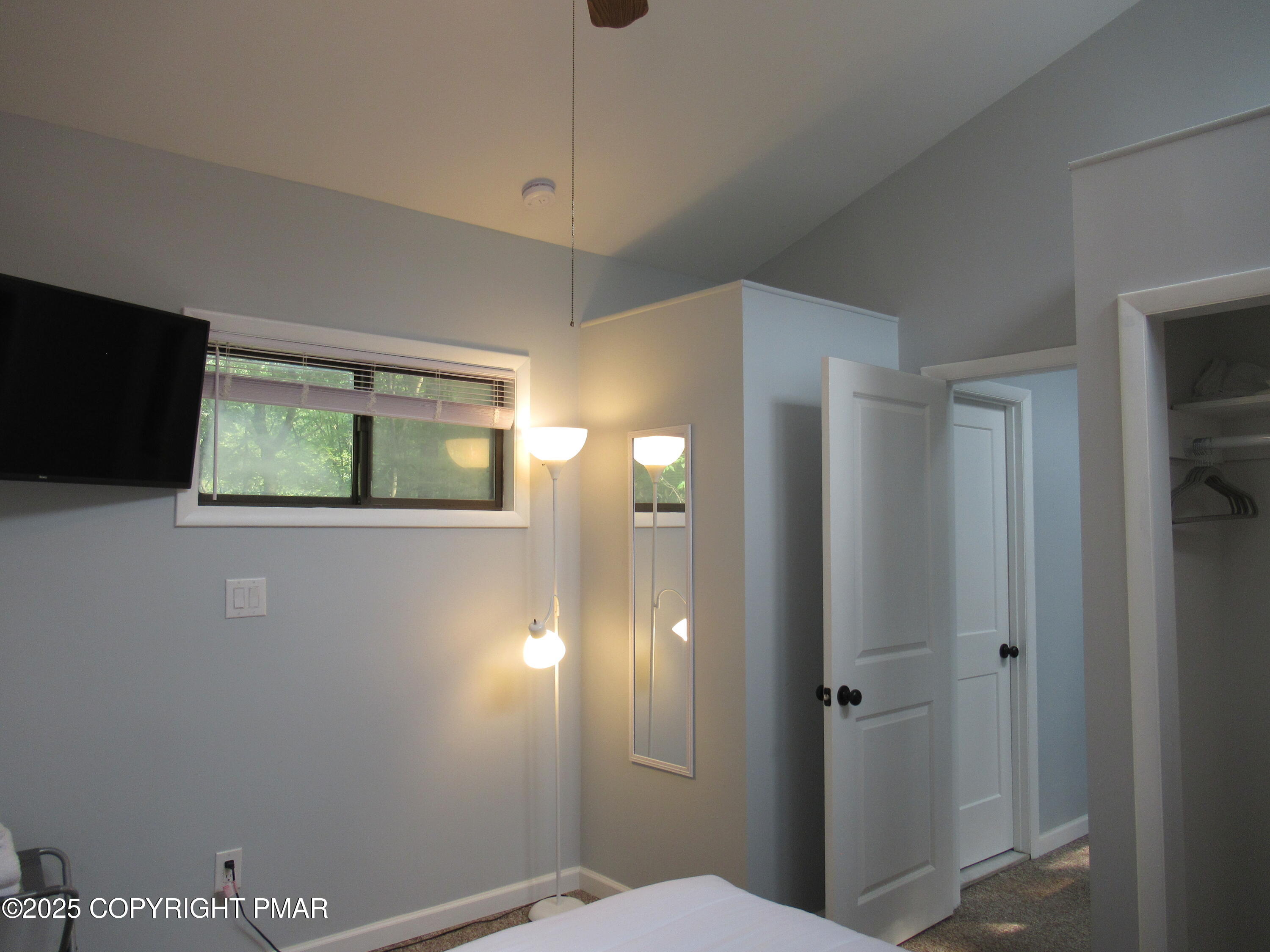 11 Maplewood Road Lake Harmony, PA 18624 - Photo 22 of 44 a view of a hallway with wooden floor and a bathroom