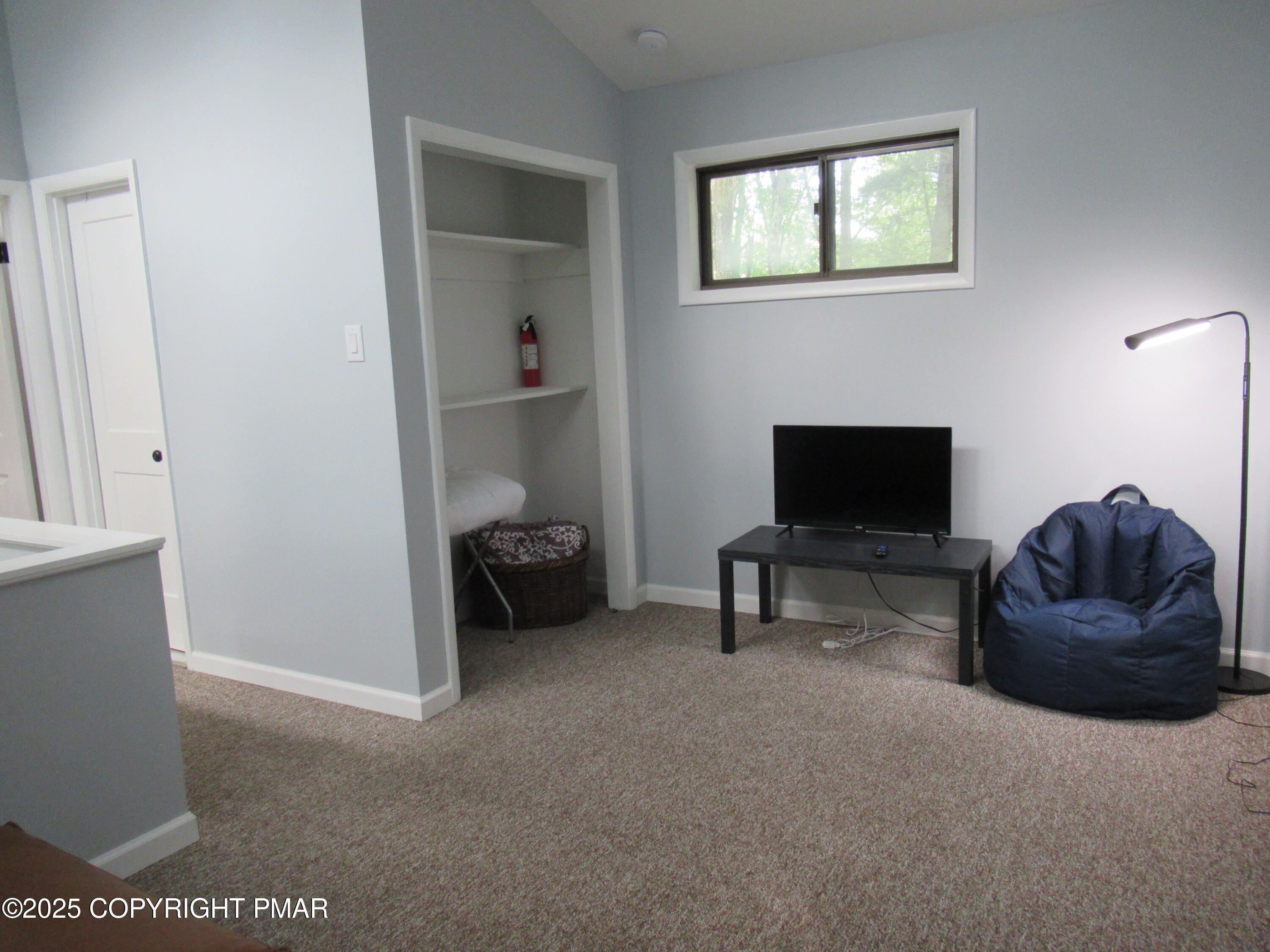 11 Maplewood Road Lake Harmony, PA 18624 - Photo 23 of 44 a living room with furniture and a flat screen tv