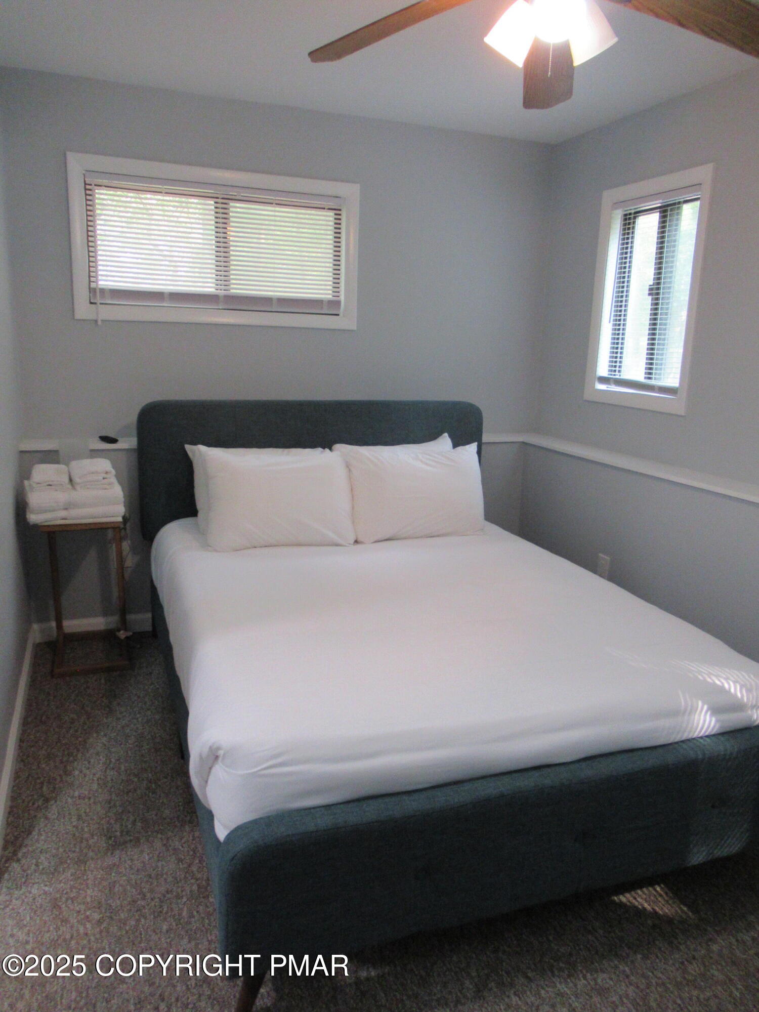 11 Maplewood Road Lake Harmony, PA 18624 - Photo 25 of 44 a bed sitting in a bedroom next to a window