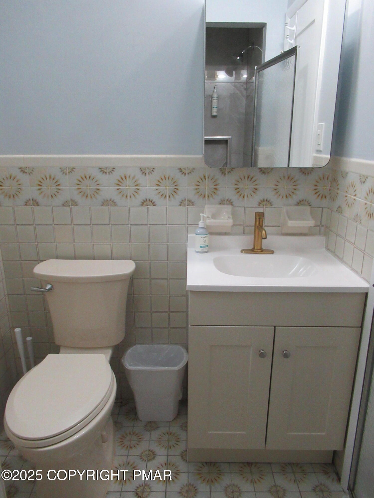 11 Maplewood Road Lake Harmony, PA 18624 - Photo 28 of 44 a bathroom with a toilet a sink and mirror