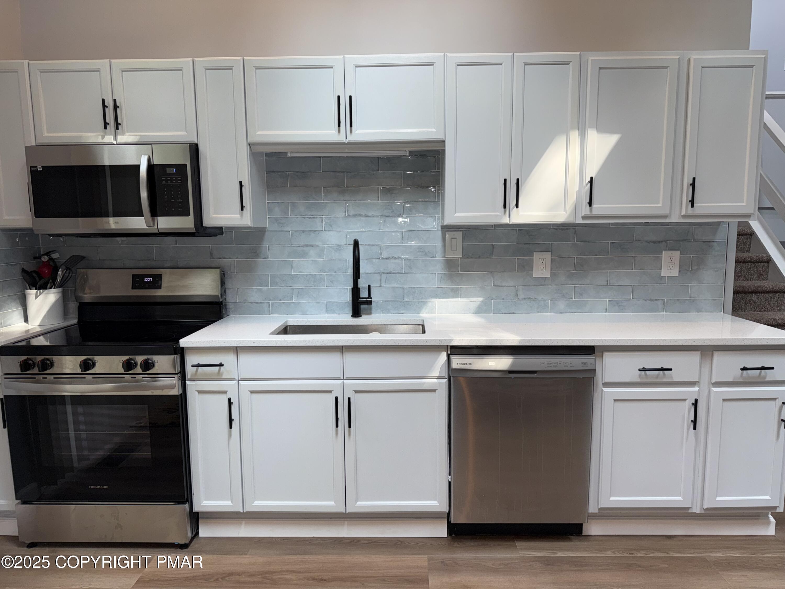 11 Maplewood Road Lake Harmony, PA 18624 - Photo 6 of 44 a kitchen with stainless steel appliances granite countertop a sink and a stove