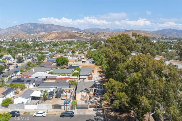 a view of a city with mountains in the background