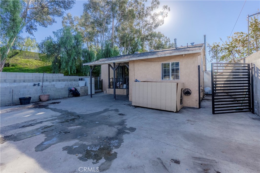 11602 Fellows Avenue Pacoima, CA 91331 - Photo 16 of 40 a view of a house with a yard and garage