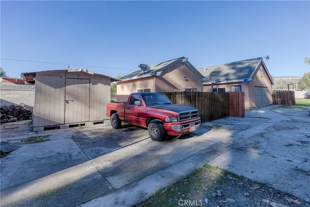 a view of a car in front of a house