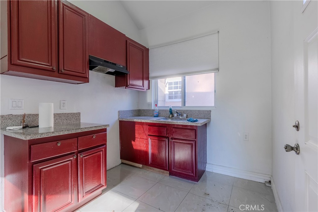 11602 Fellows Avenue Pacoima, CA 91331 - Photo 21 of 40 a kitchen with stainless steel appliances granite countertop a sink dishwasher stove and cabinets