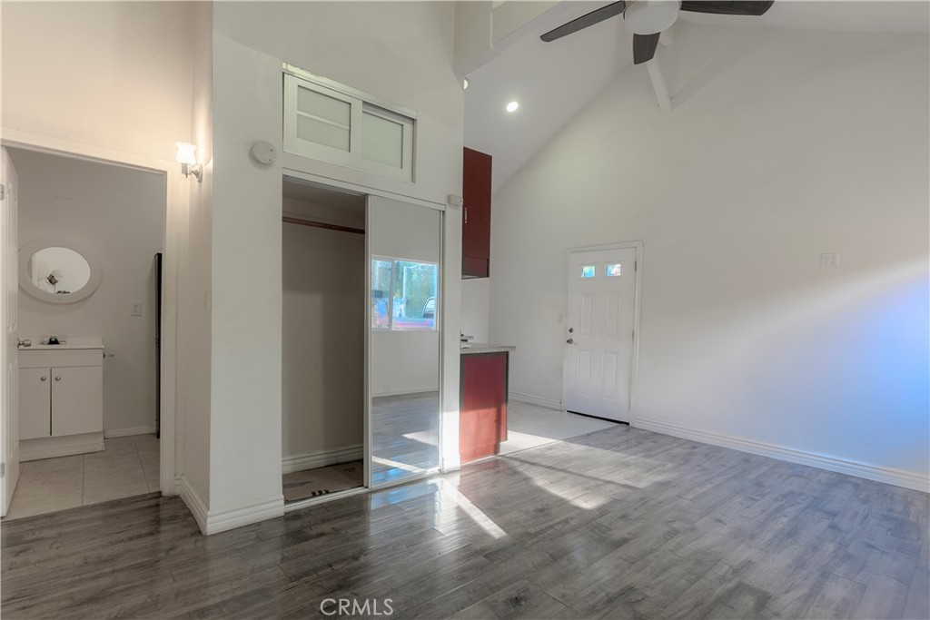 11602 Fellows Avenue Pacoima, CA 91331 - Photo 23 of 40 an empty room with wooden floor and windows