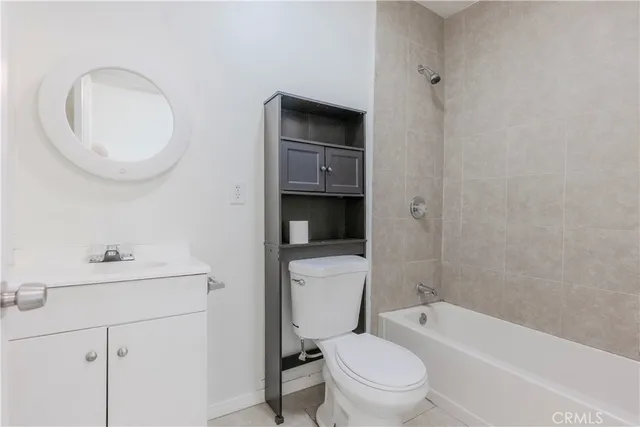 a bathroom with a toilet a sink and bathtub