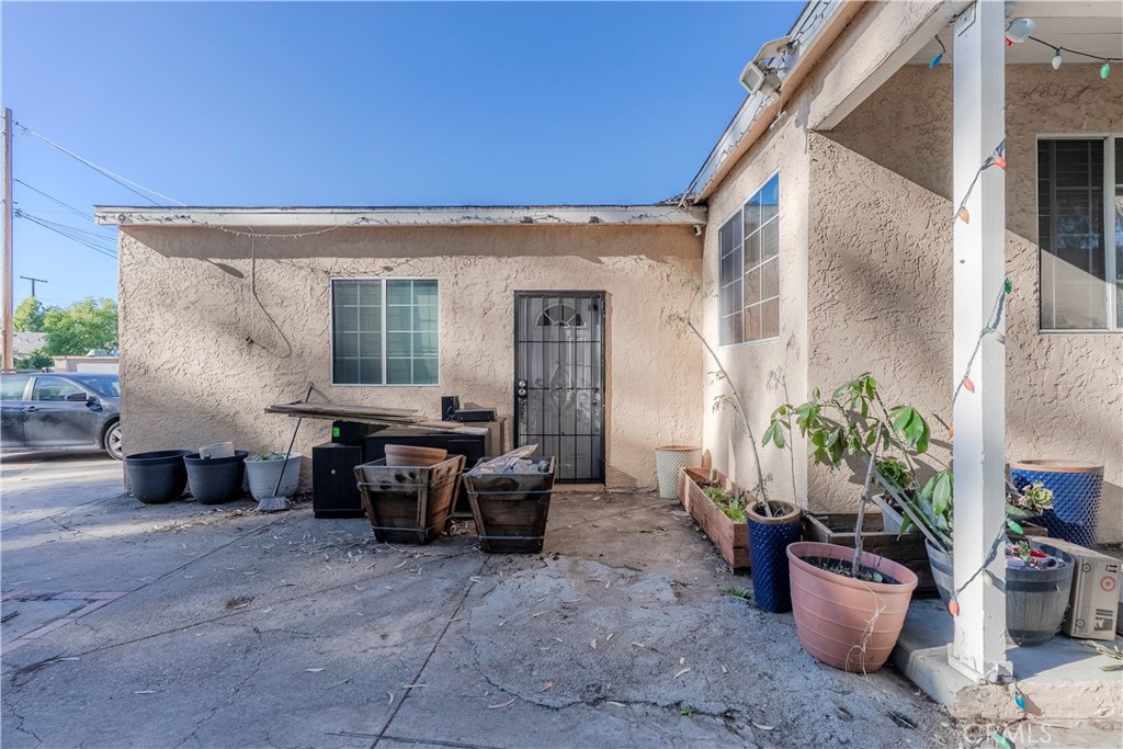 11602 Fellows Avenue Pacoima, CA 91331 - Photo 3 of 40 a living room with furniture and potted plants