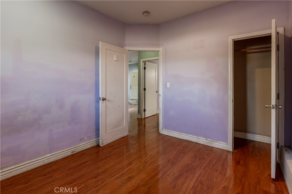 11602 Fellows Avenue Pacoima, CA 91331 - Photo 33 of 40 an empty room with wooden floor and closet