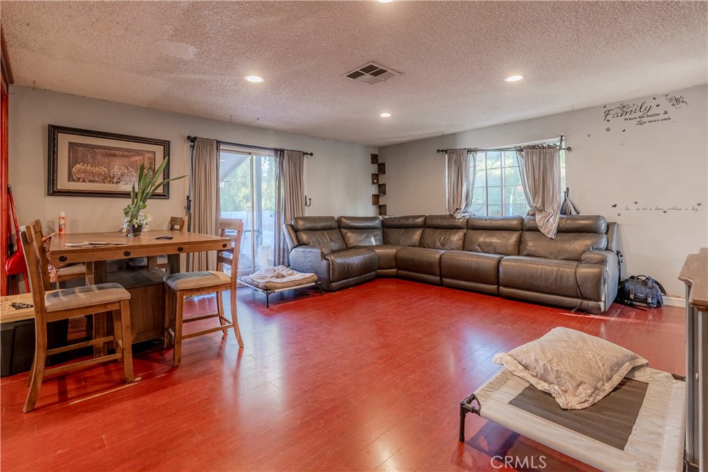 11602 Fellows Avenue Pacoima, CA 91331 - Photo 5 of 40 a living room with furniture and a wooden floor