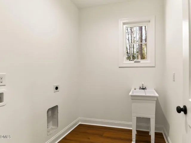 a bathroom with a sink toilet and mirror