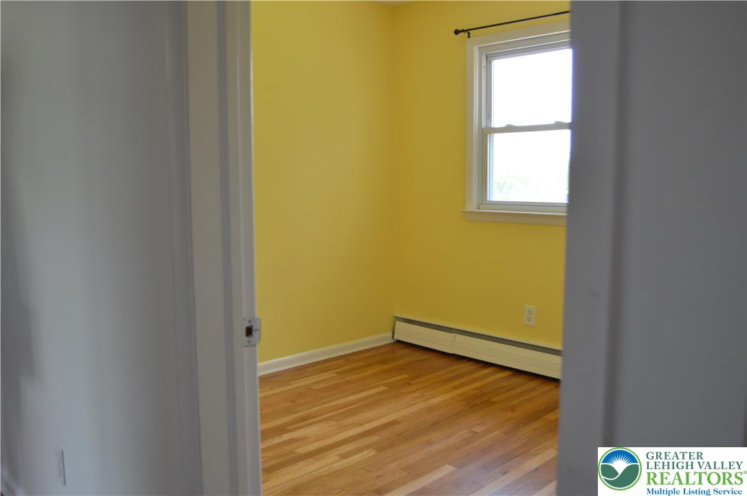 1819 Blue Barn Road Orefield, PA 18069 - Photo 14 of 21 Hardwood flooring extends throughout this light-filled space, featuring a classic window.