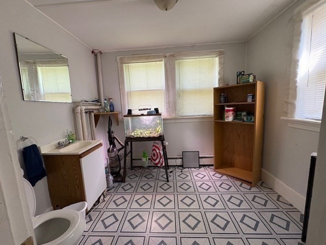 24 Lowell Street Wilmington, MA 01887 - Photo 11 of 26 a room with furniture a rug and a window
