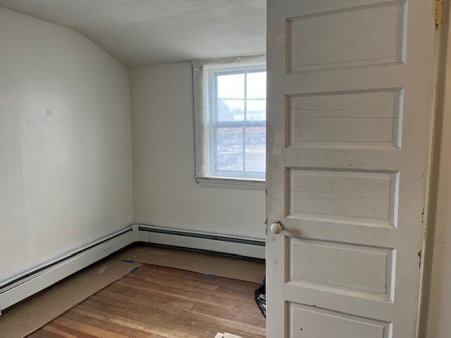 24 Lowell Street Wilmington, MA 01887 - Photo 14 of 26 a view of a room with rack on the wall