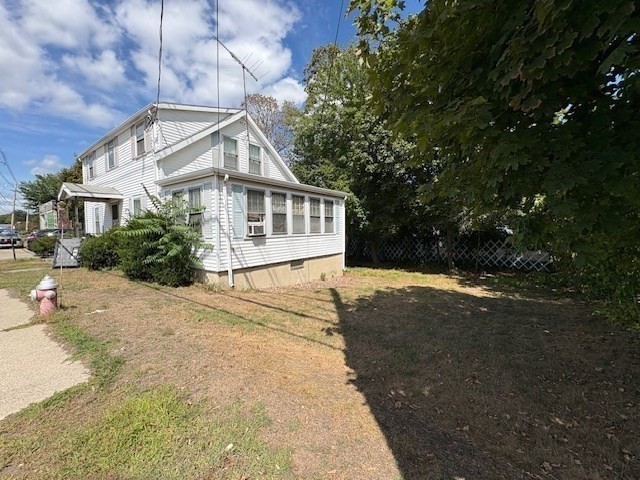 24 Lowell Street Wilmington, MA 01887 - Photo 23 of 26 a view of a house with a yard
