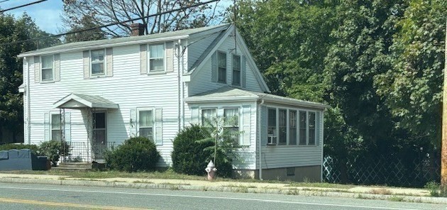 24 Lowell Street Wilmington, MA 01887 - Photo 25 of 26 a view of a house with a yard