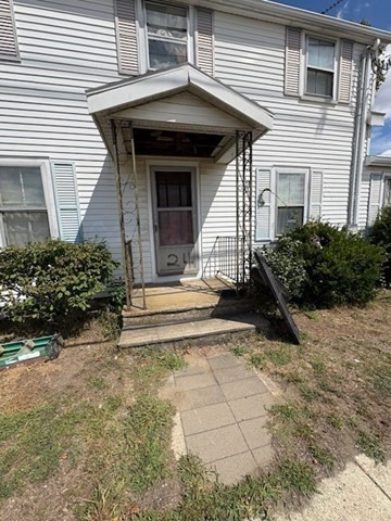 24 Lowell Street Wilmington, MA 01887 - Photo 3 of 26 a view of a house with potted plants