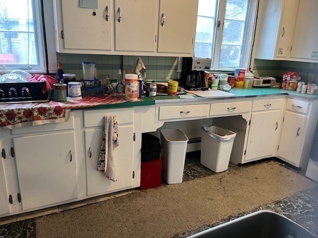 24 Lowell Street Wilmington, MA 01887 - Photo 5 of 26 a kitchen with stainless steel appliances granite countertop a sink a stove and a microwave