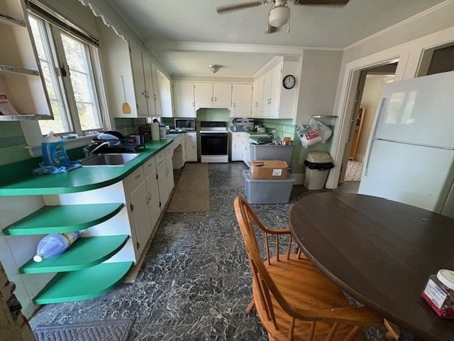 24 Lowell Street Wilmington, MA 01887 - Photo 6 of 26 a kitchen with sink refrigerator and window