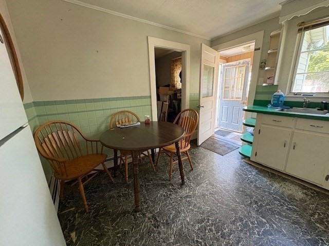 24 Lowell Street Wilmington, MA 01887 - Photo 8 of 26 a view of a dining room with furniture and a window