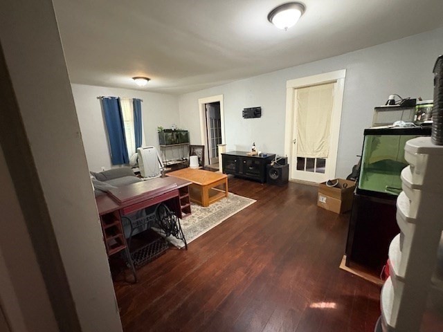 24 Lowell Street Wilmington, MA 01887 - Photo 9 of 26 a living room with furniture and a wooden floor