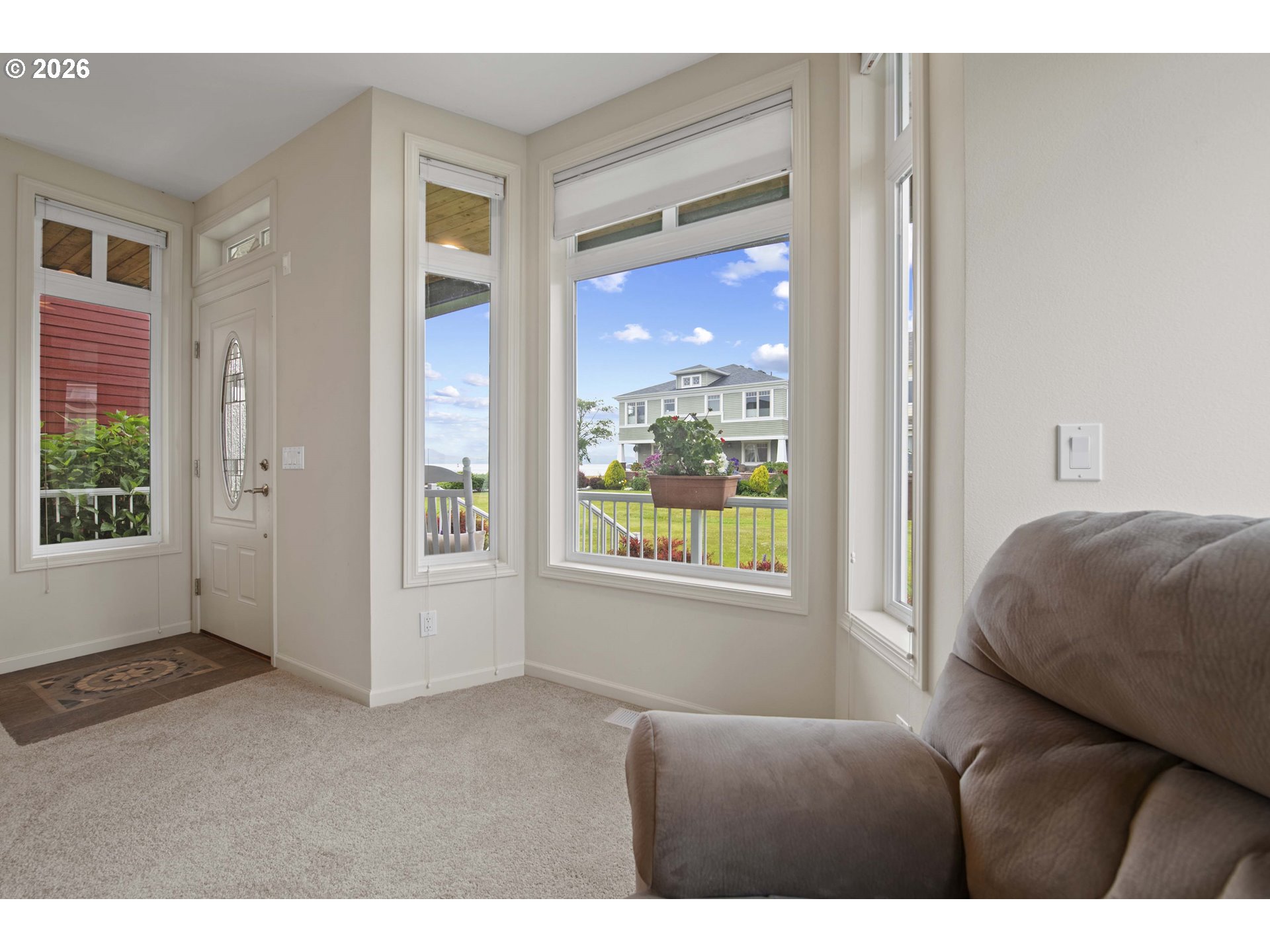 230 Round House Road Astoria, OR 97103 - Photo 8 of 43 a living room with furniture and a window
