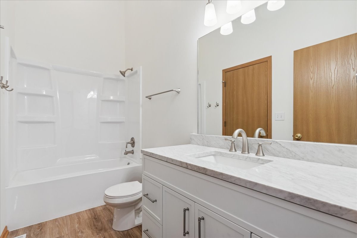 17440 Yakima Drive Lockport, IL 60441 - Photo 15 of 20 a bathroom with a sink a toilet and shower