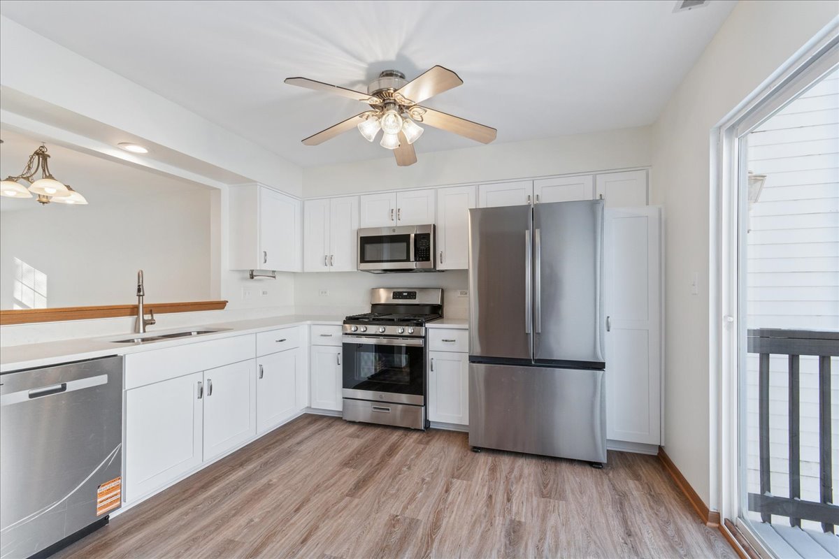 17440 Yakima Drive Lockport, IL 60441 - Photo 5 of 20 a kitchen with a refrigerator cabinets and wooden floor