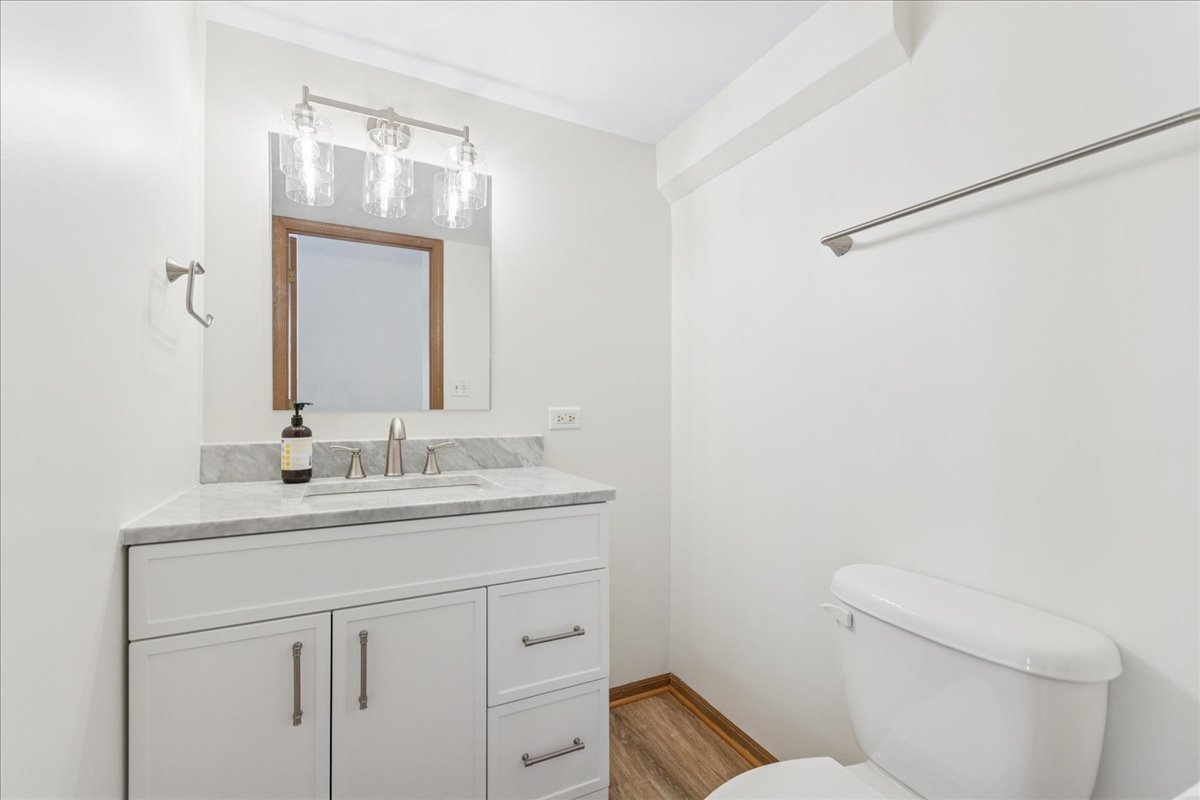 17440 Yakima Drive Lockport, IL 60441 - Photo 9 of 20 a bathroom with a granite countertop sink a toilet and a mirror